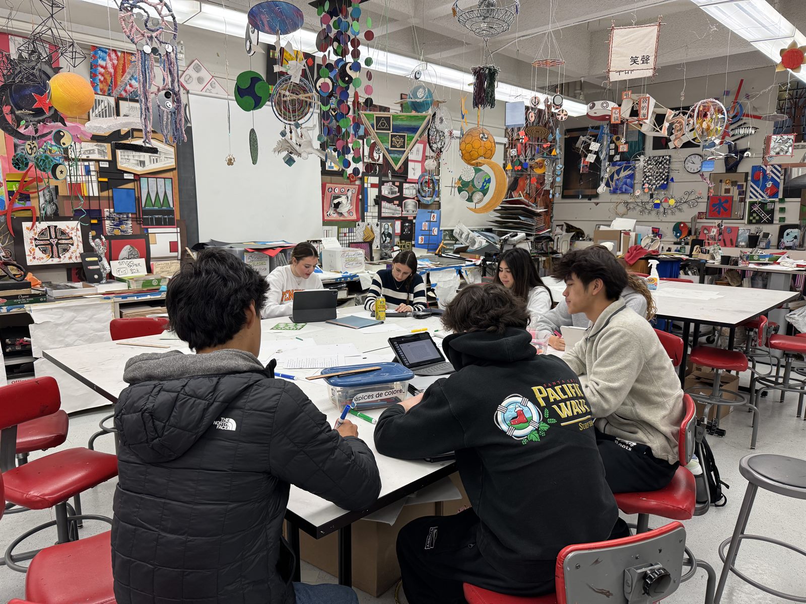 Volunteers writing letters together at a table