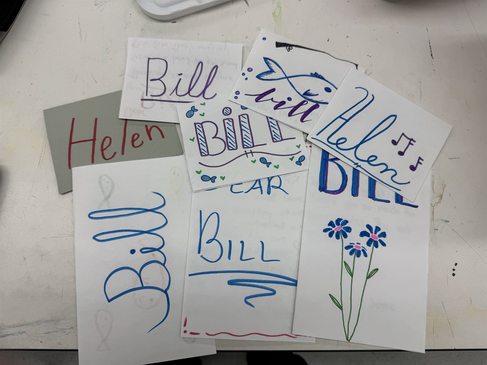 A spread of hand-decorated letters addressed to Bill and Helen